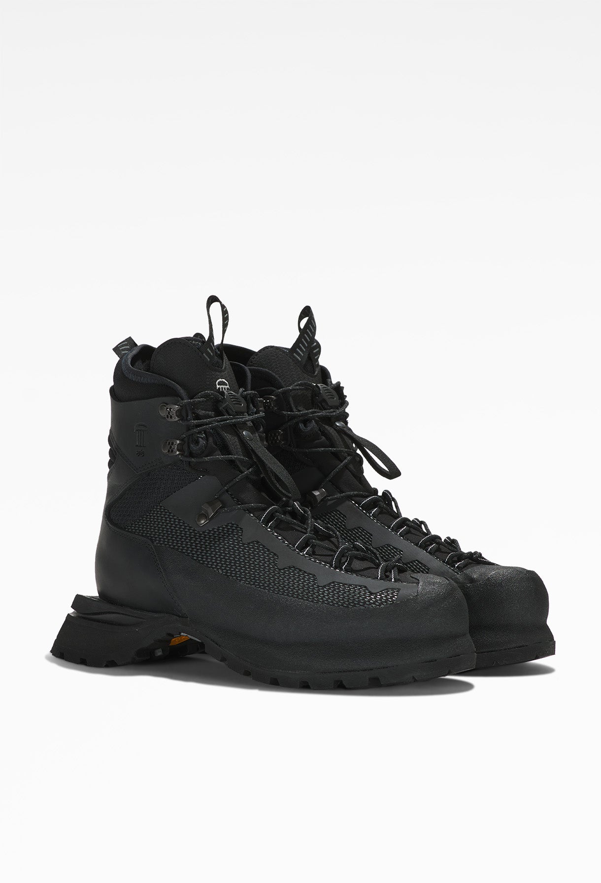 Black hiking boot with rugged design, sturdy laces, metal eyelets, and thick, treaded sole.