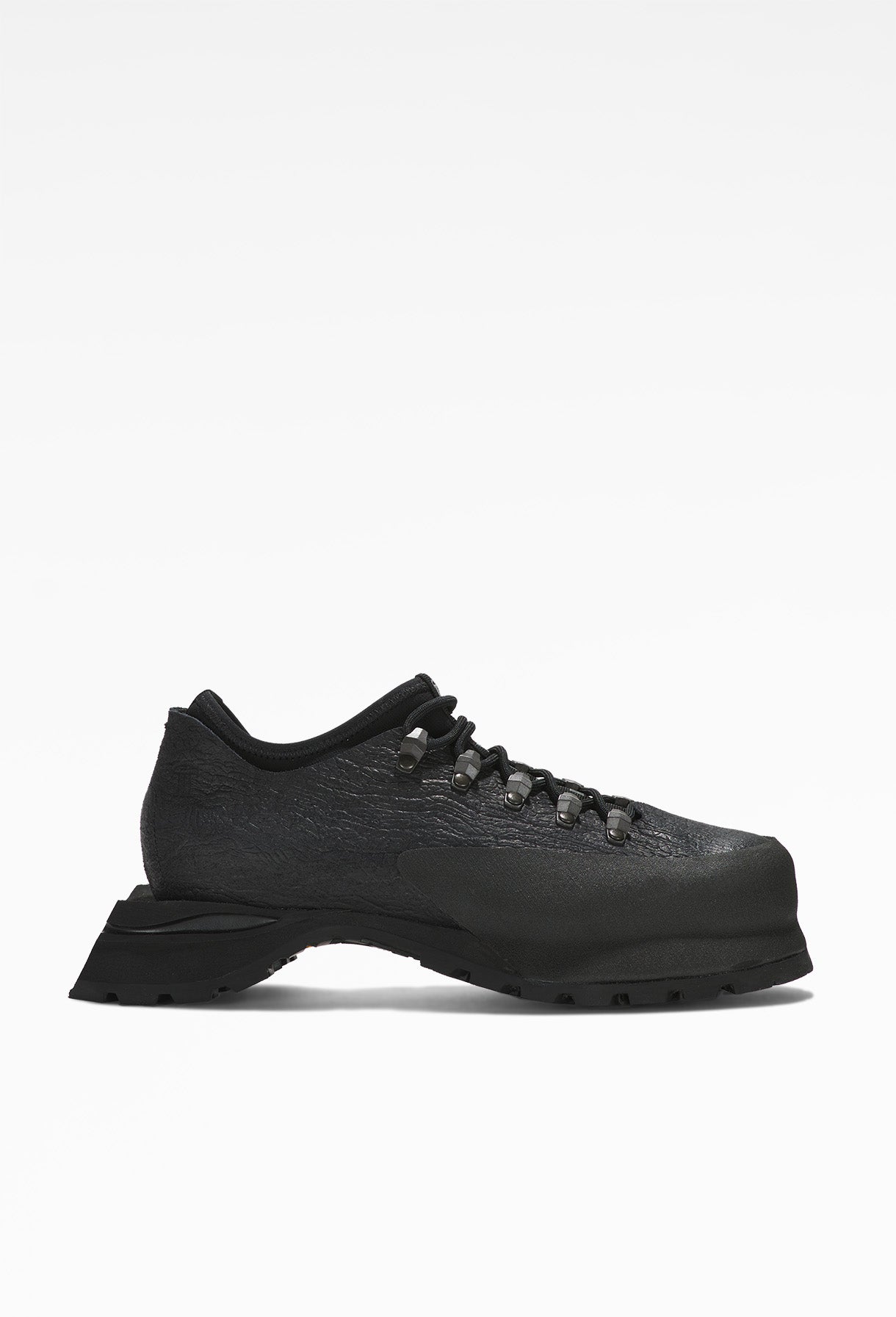 Black hiking boots with sturdy soles, intricate lacing, rugged design, mesh fabric sides, and metal eyelets.