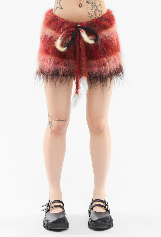 Gucci - Fuzzy Multicolored Mini Skirt  
Dr. Martens - Black Shoes  